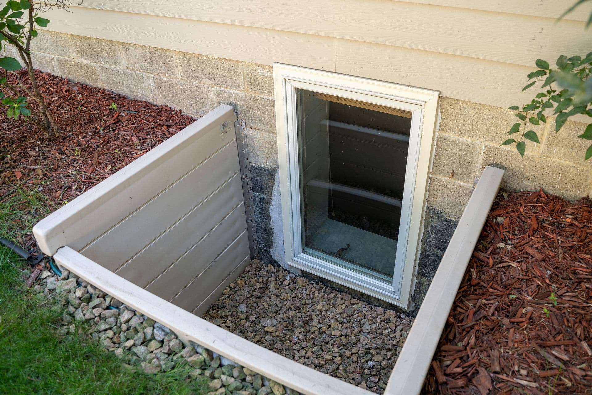 Exterior view of a basement egress window