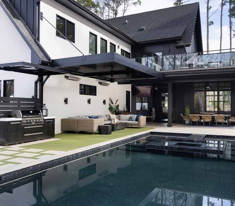 motorized louvered pergola by pool